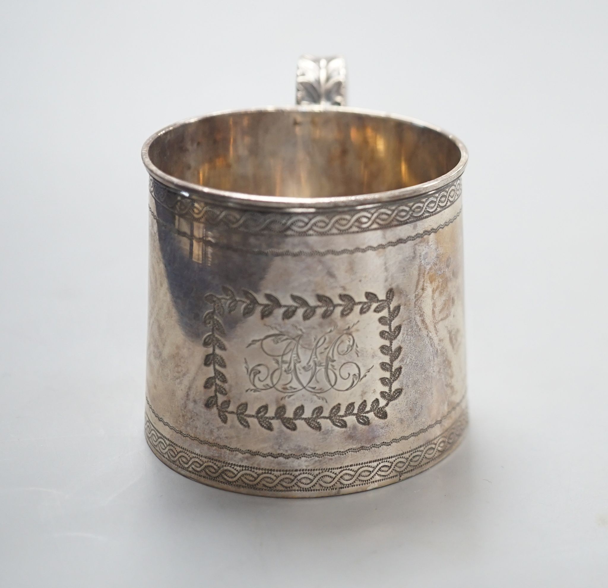 A George III silver small mug, Thomas Wallis & Jonthan Hayne, London, 1818, with engraved monogram, 57mm, 60 grams.